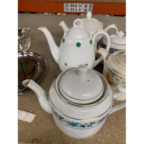 1134 - A GROUP OF FIVE TEAPOTS