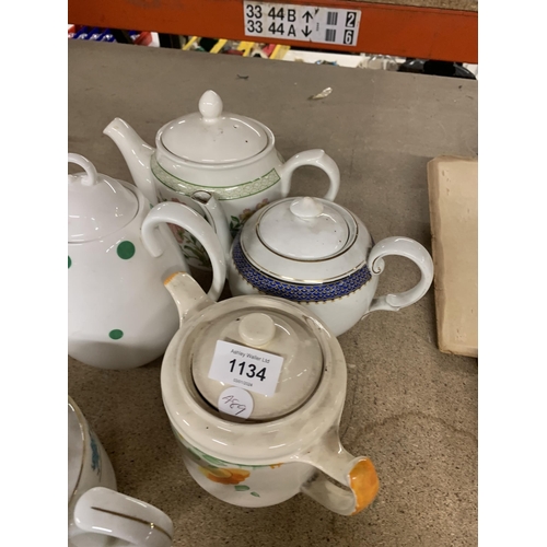 1134 - A GROUP OF FIVE TEAPOTS