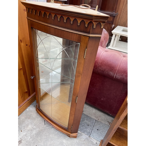 2561 - A MODERN YEW WOOD GLAZED CORNER CUPBOARD, 23