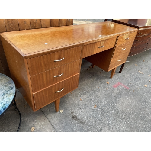 2577 - A RETRO SATINWOOD DESK ENCLOSING SEVEN DRAWERS, 60