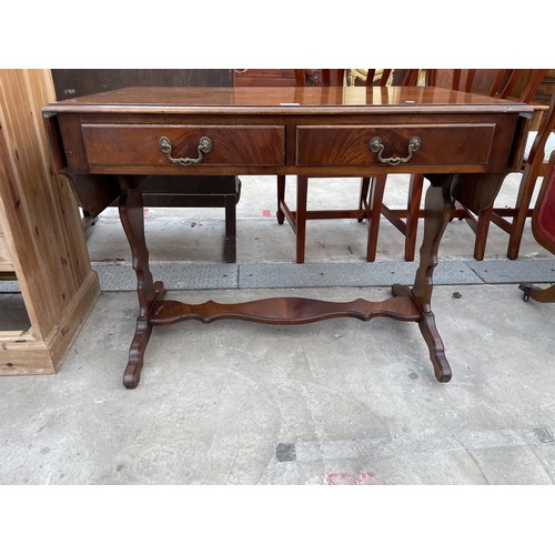 2588 - A MAHOGANY AND CROSSBANDED SOFA TABLE ENCLOSING TWO DRAWERS