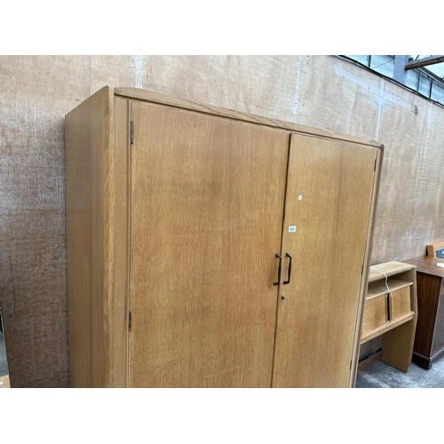 2851 - AN OAK LEBUS LINK TWO DOOR WARDROBE AND 4'6' CONTINENTAL HEADBOARD