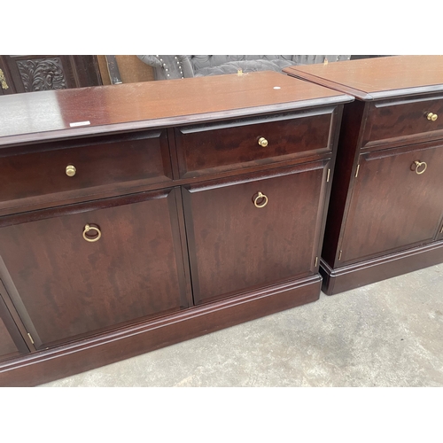 2902 - A STAG MINSTREL SIDEBOARD ENCLOSING THREE DRAWERS AND THREE CUPBOARDS, 54