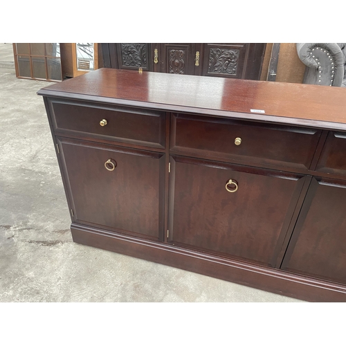 2902 - A STAG MINSTREL SIDEBOARD ENCLOSING THREE DRAWERS AND THREE CUPBOARDS, 54