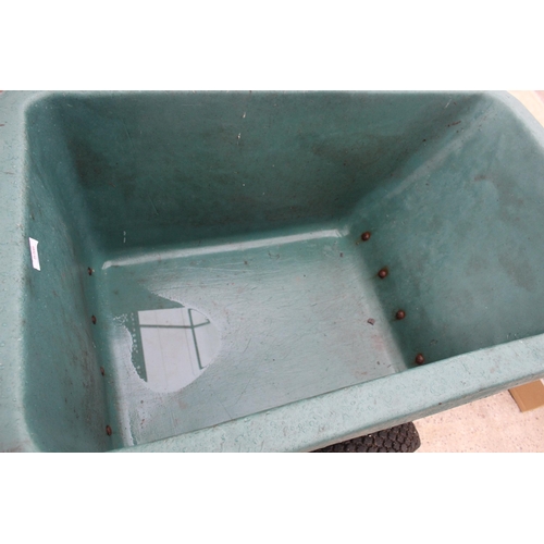 556 - A 2 WHEELED WHEELBARROW  + VAT