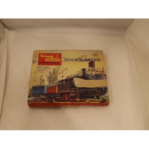 116 - A VINTAGE TRI-ANG DOCKMASTER CLOCKWORK TRAIN SET - BOXED