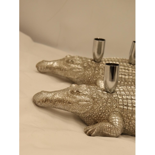 134 - A PAIR OF HEAVY SILVER COLOURED CROCODILE CANDLE HOLDERS, LENGTH 44CM