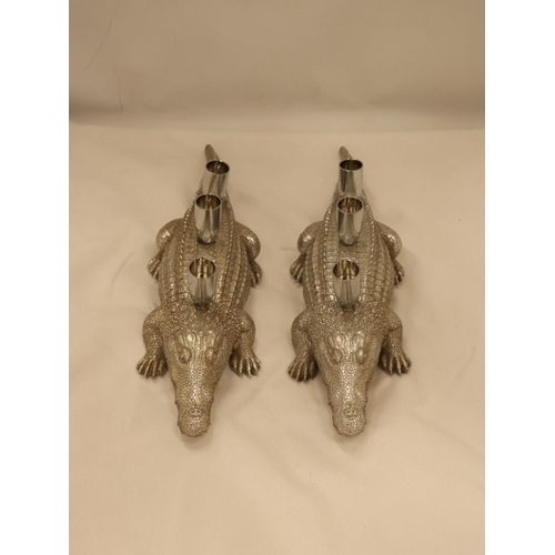 134 - A PAIR OF HEAVY SILVER COLOURED CROCODILE CANDLE HOLDERS, LENGTH 44CM