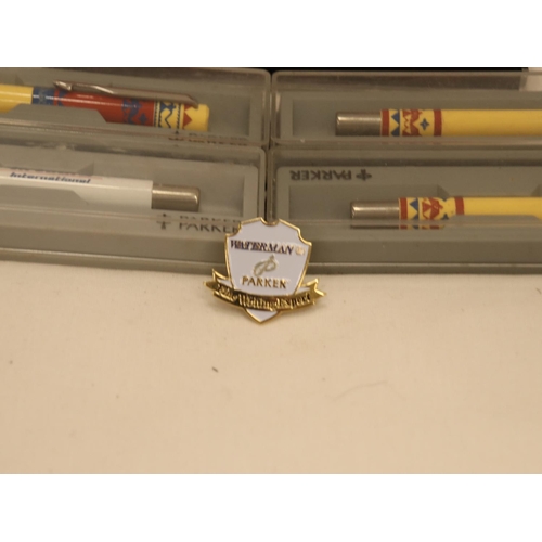 149 - FIVE BOXED PARKER PENS PLUS A PARKER BADGE