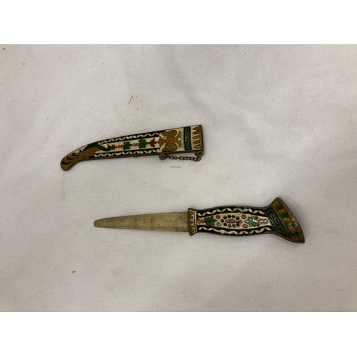 165 - AN ORNATE ENAMEL DESIGN DAGGER AND SCABBARD