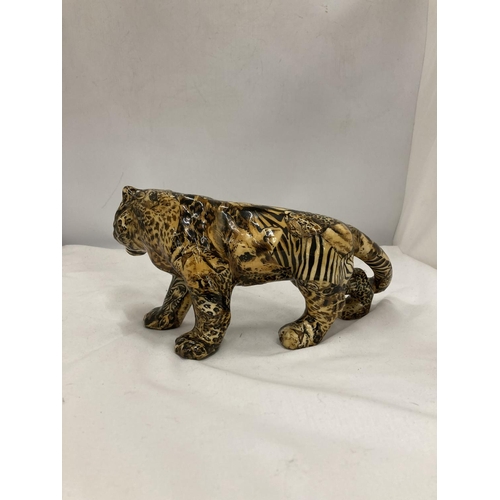 169 - A MODEL OF A LARGE CAT WITH A PATCHWORK SAFARI DESIGN, HEIGHT 15CM, LENGTH 30CM