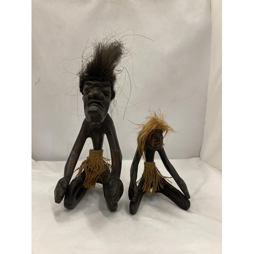 173 - TWO GROTESQUE ETHNIC KNEELING FIGURES