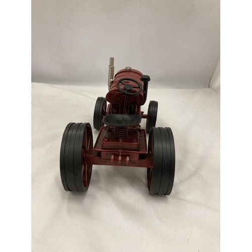 198 - A TIN PLATE AND STEEL RED TRACTOR, HEIGHT 15CM, LENGTH 25CM