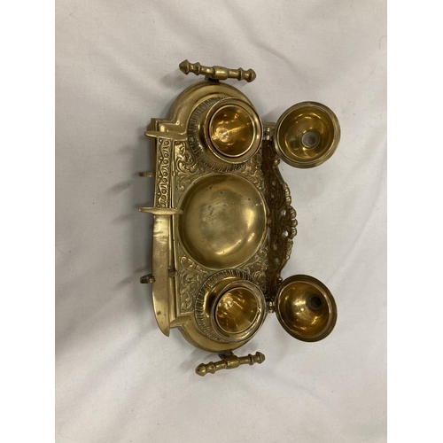 208 - AN ORNATE VINTAGE BRASS INKWELL STAND