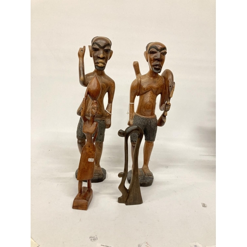 214 - TWO LARGE TRIBAL STYLE FIGURES PLUS TWO SMALLER ONES