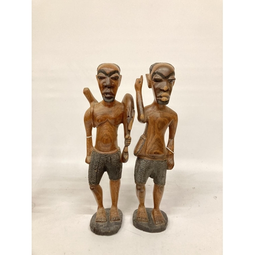 214 - TWO LARGE TRIBAL STYLE FIGURES PLUS TWO SMALLER ONES