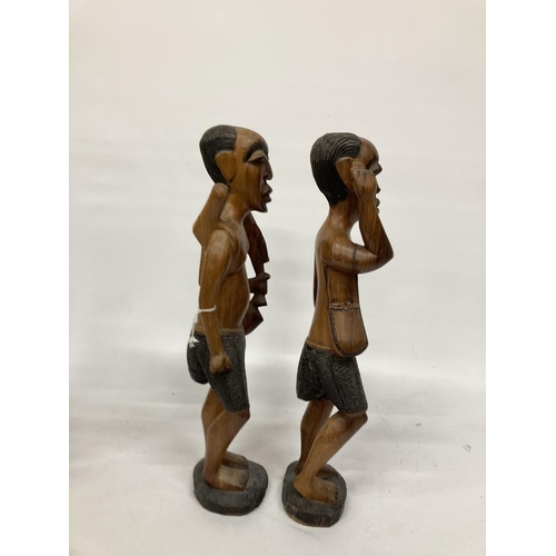 214 - TWO LARGE TRIBAL STYLE FIGURES PLUS TWO SMALLER ONES