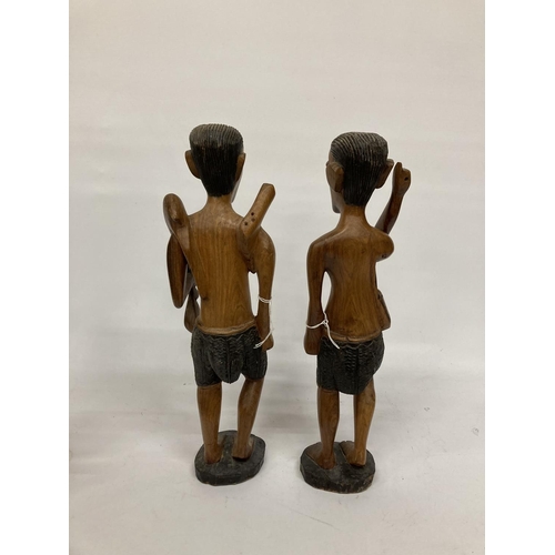 214 - TWO LARGE TRIBAL STYLE FIGURES PLUS TWO SMALLER ONES