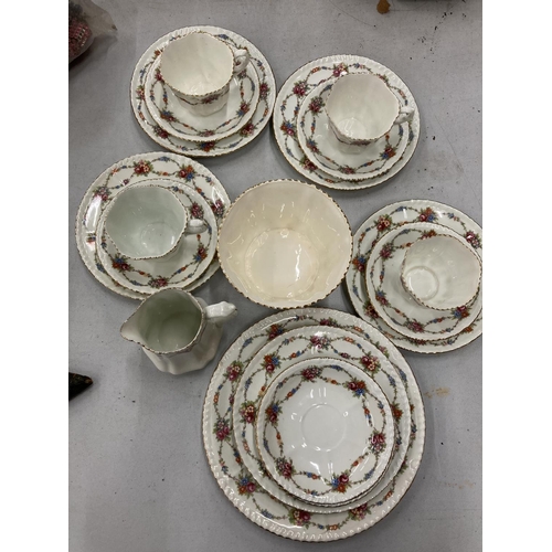 232 - AN ANTIQUE CHINA PART TEASET TO INCLUDE A CAKE PLATE, SUGAR BOWL, CREAM JUG, CUPS, SAUCERS AND SIDE ... 