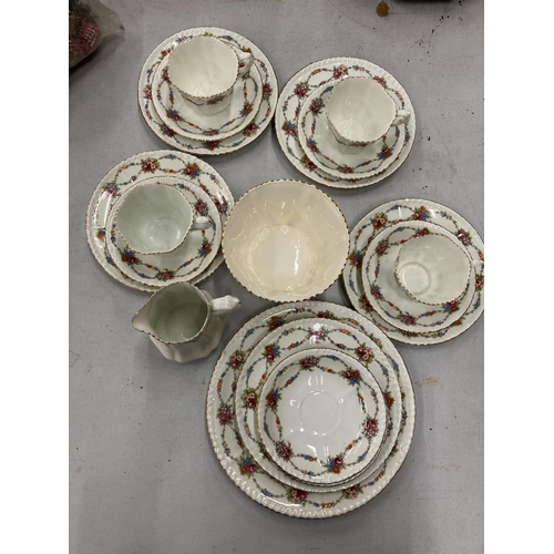 232 - AN ANTIQUE CHINA PART TEASET TO INCLUDE A CAKE PLATE, SUGAR BOWL, CREAM JUG, CUPS, SAUCERS AND SIDE ... 