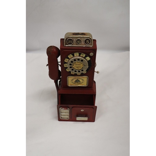 246 - AN UNUSUAL USA VINTAGE TIN PLATE PHONE MONEY BOX, HEIGHT 33CM