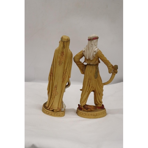 253 - TWO VERY HEAVY SHEIKH AND ARAB LADY FIGURES, HEIGHT 31CM