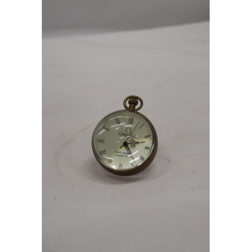 264 - A BRASS AND GLASS BUBBLE CLOCK