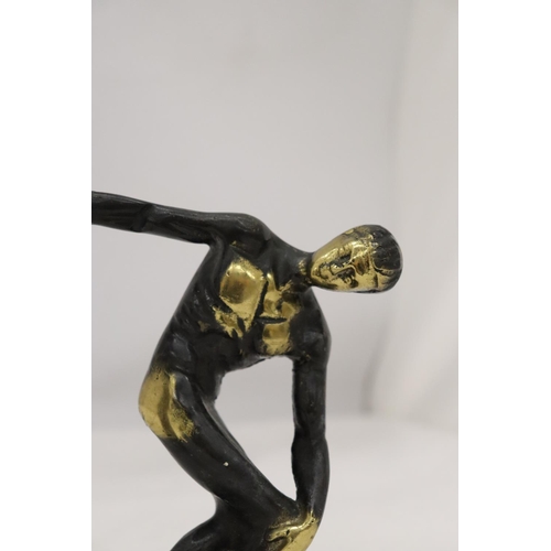 272 - A HEAVY BRASS AND A WHITE METAL DISCUS THROWER