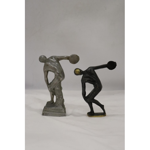 272 - A HEAVY BRASS AND A WHITE METAL DISCUS THROWER