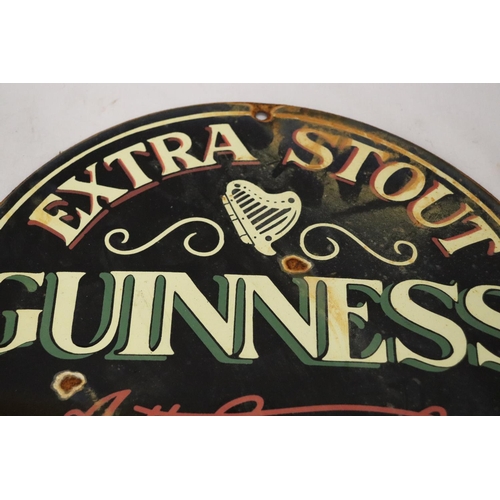 279 - AN ENAMEL EXTRA STOUT GUINNESS CIRCULAR SIGN