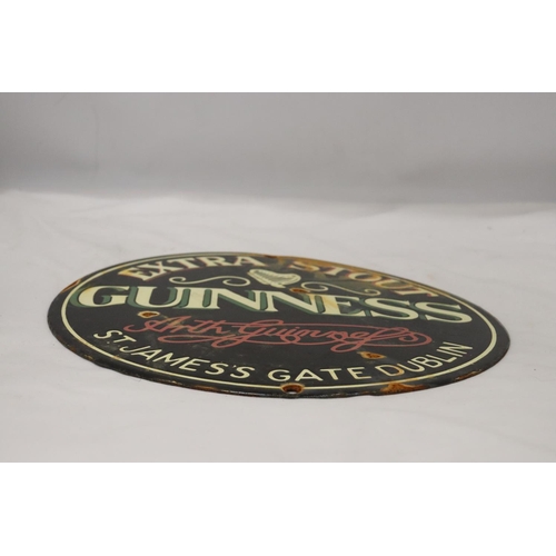 279 - AN ENAMEL EXTRA STOUT GUINNESS CIRCULAR SIGN