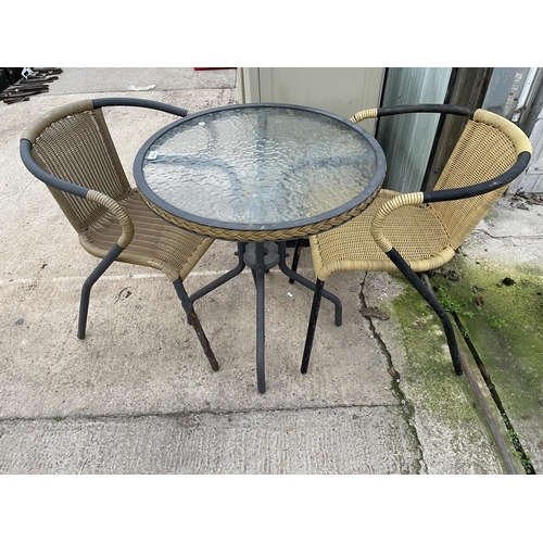 1629 - A GLASS TOPPED BISTRO TABLE AND TWO RATTAN EFFECT CHAIRS