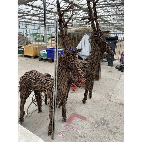 1661 - THREE GRADUATED WICKER REINDEER