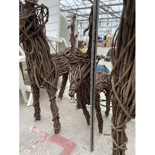 1661 - THREE GRADUATED WICKER REINDEER