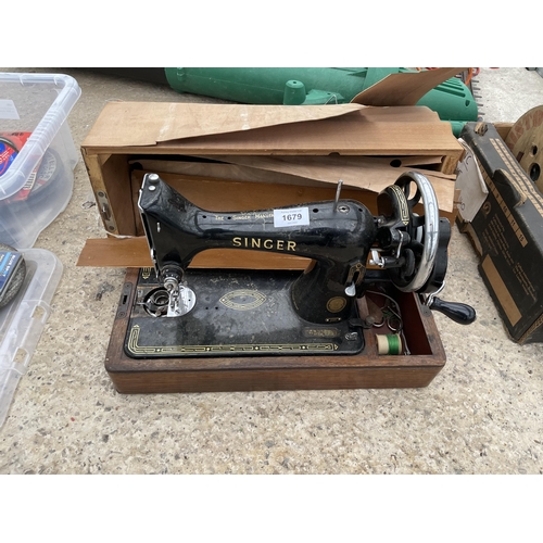 1679 - A VINTAGE SINGER SEWING MACHINE WITH A CARRY CASE