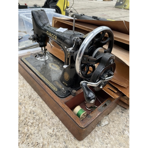 1679 - A VINTAGE SINGER SEWING MACHINE WITH A CARRY CASE