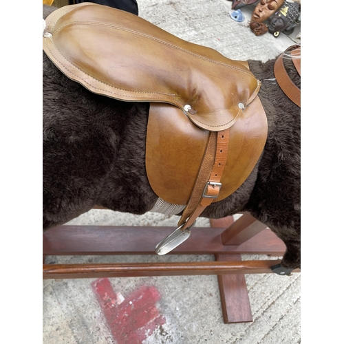 1705 - A VINTAGE BROWN AND WHITE CHILDRENS ROCKING HORSE