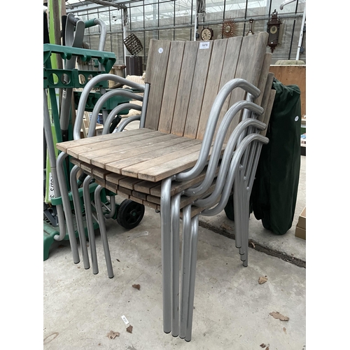 1879 - FOUR GARDEN METAL FRAMED STACKING CHAIRS