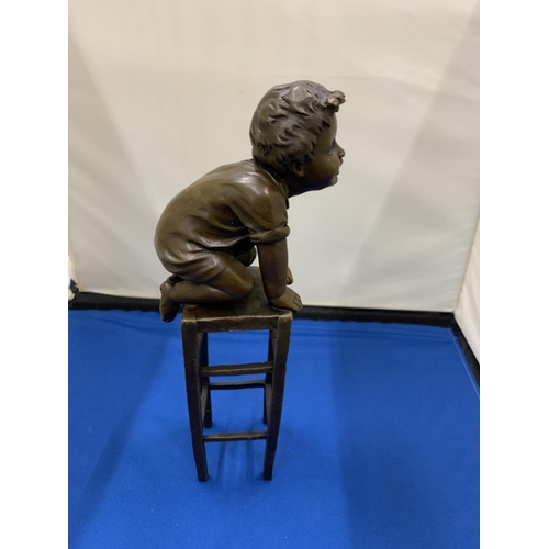 2 - A BRONZE MODEL OF A CHILD KNEELING ON A STOOL SIGNED