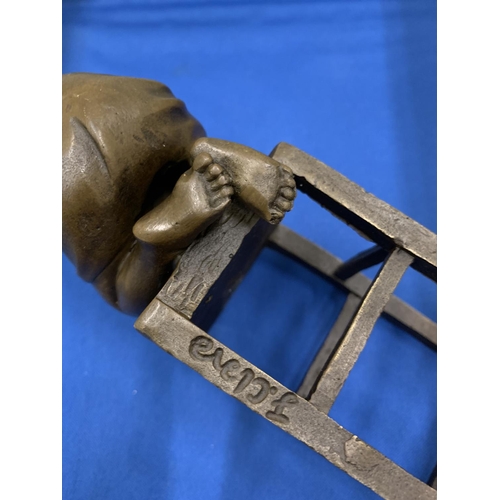 2 - A BRONZE MODEL OF A CHILD KNEELING ON A STOOL SIGNED