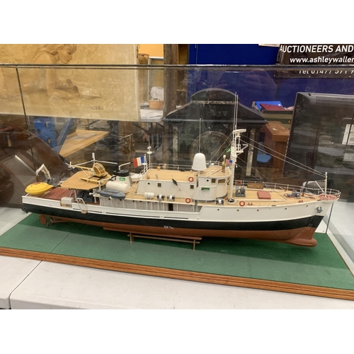 3 - A LARGE MODEL OF A BOAT WITH HELICOPTER IN A GLASS CASE