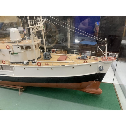 3 - A LARGE MODEL OF A BOAT WITH HELICOPTER IN A GLASS CASE