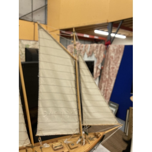 34 - A LARGE MODEL OF A SAILING SHIP