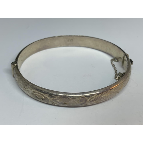 695 - THREE SILVER BANGLES