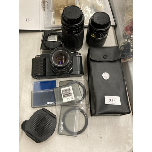 811 - A CANON T50 CAMERA, 3 LENSES, ASSORTED FILTERS AND EXTRAS