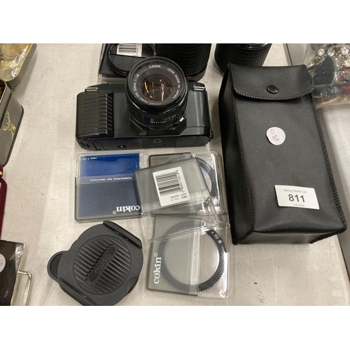 811 - A CANON T50 CAMERA, 3 LENSES, ASSORTED FILTERS AND EXTRAS