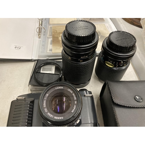 811 - A CANON T50 CAMERA, 3 LENSES, ASSORTED FILTERS AND EXTRAS