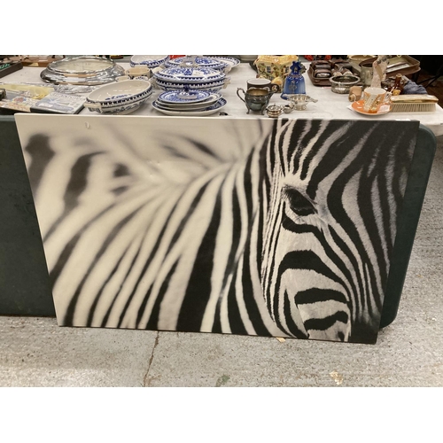 870 - A LARGE PRINT ON CANVAS OF A ZEBRA, 118CM X 79CM