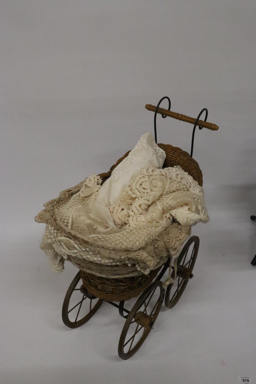 A VICTORIAN CHILD'S PRAM WITH LACE COVERS