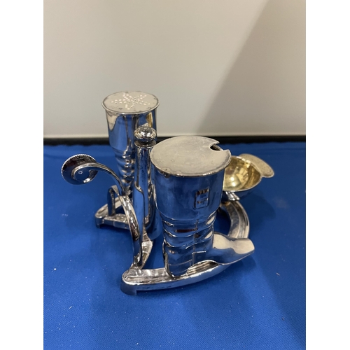 65 - AN ELKINGTON SILVER PLATED CRUET SET IN THE GUISE OF RIDING BOOTS AND HAT ST ON A HORSE SHOE BASE